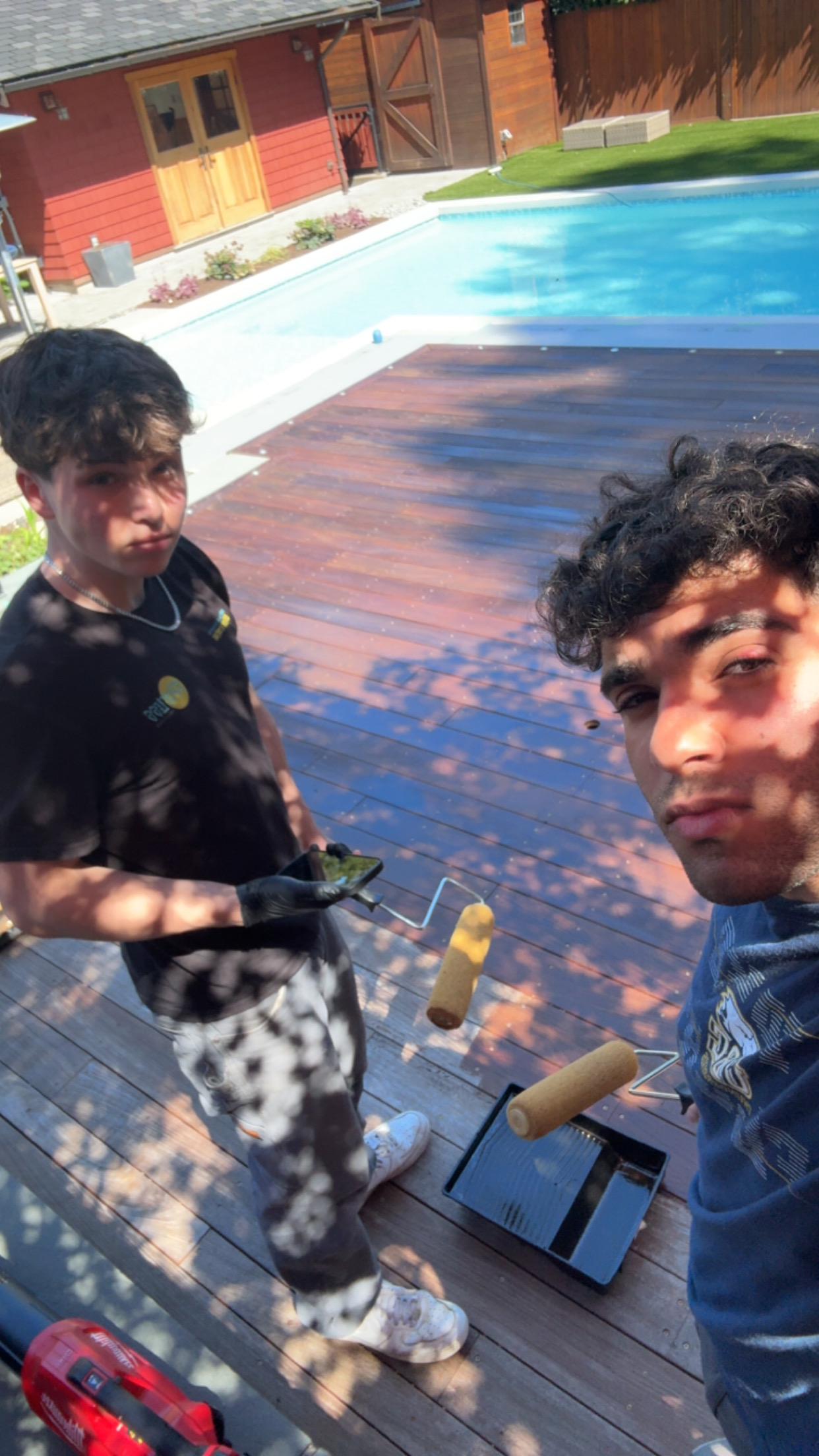 Staining deck by the pool — Spotless Solutions
